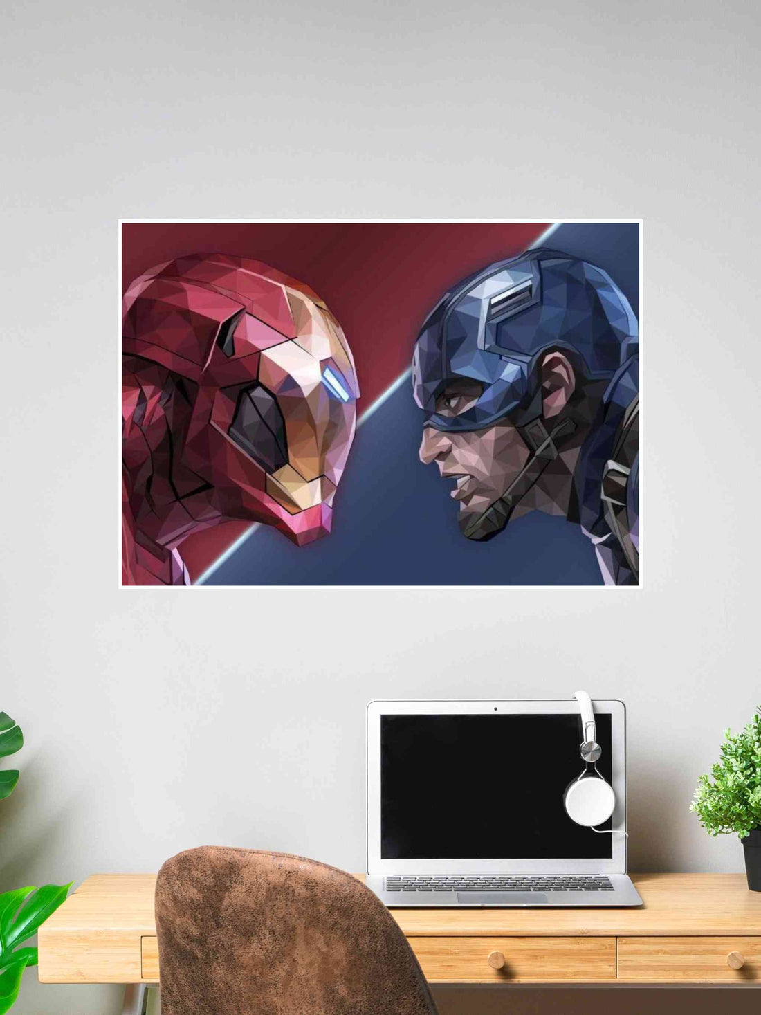 Polygonal-style art poster of Iron Man and Captain America facing off, displayed above a desk with a laptop and headset.