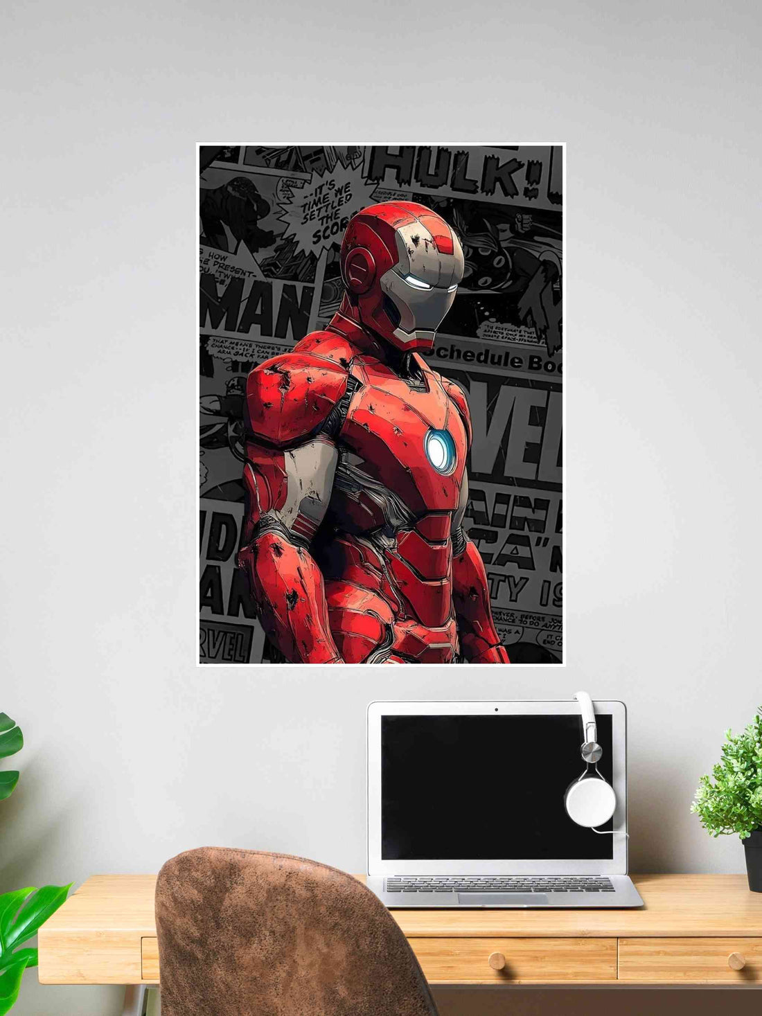 Poster of Iron Man in red armor with comic-style Marvel background, displayed on a wall above a laptop desk setup.